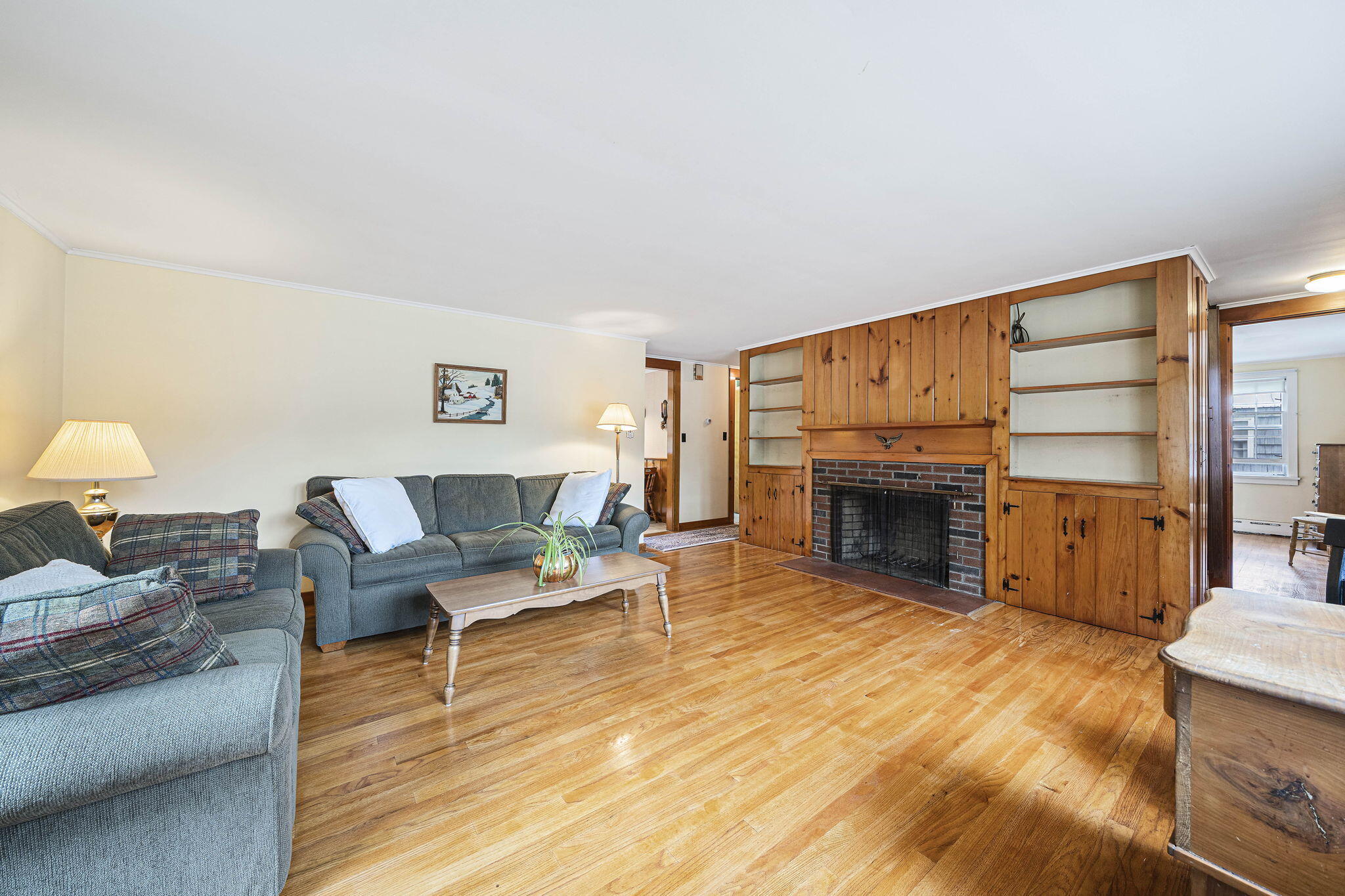 606 County Road Pocasset, MA 02559 - Photo 23 of 36 a living room with furniture a fireplace and a flat screen tv