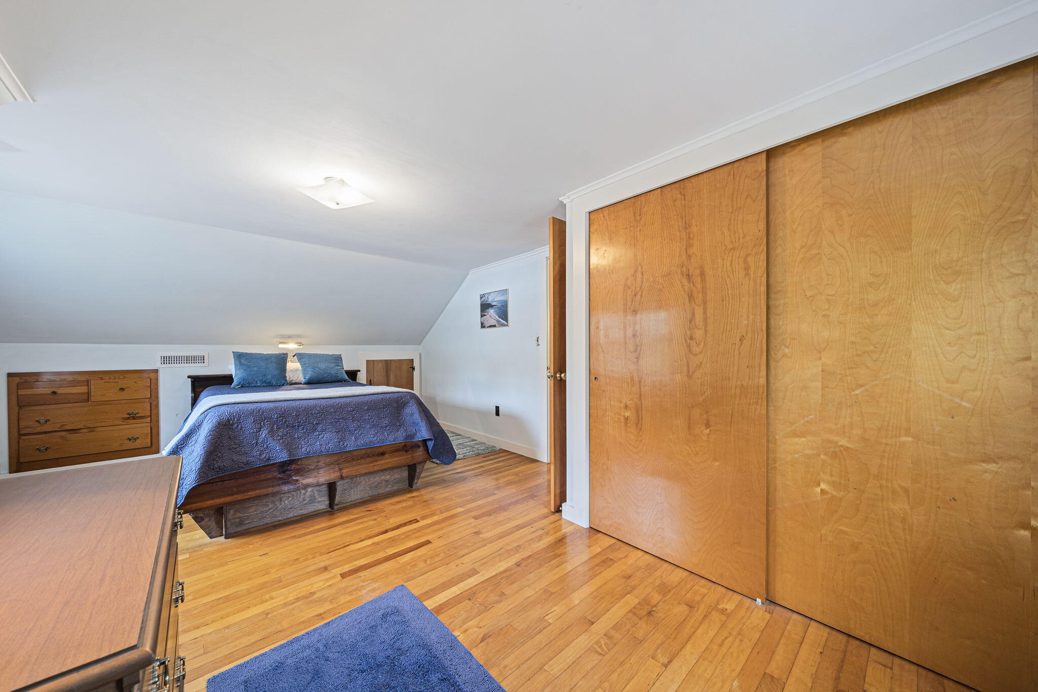 606 County Road Pocasset, MA 02559 - Photo 24 of 36 a bedroom with a bed and a dresser