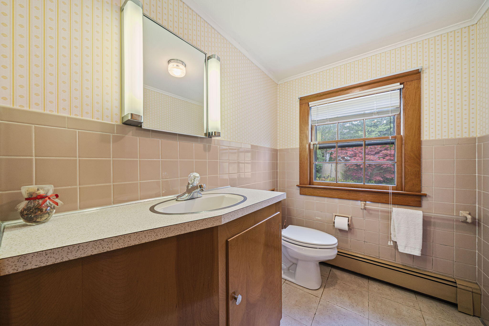 606 County Road Pocasset, MA 02559 - Photo 26 of 36 a bathroom with a sink a toilet and mirror