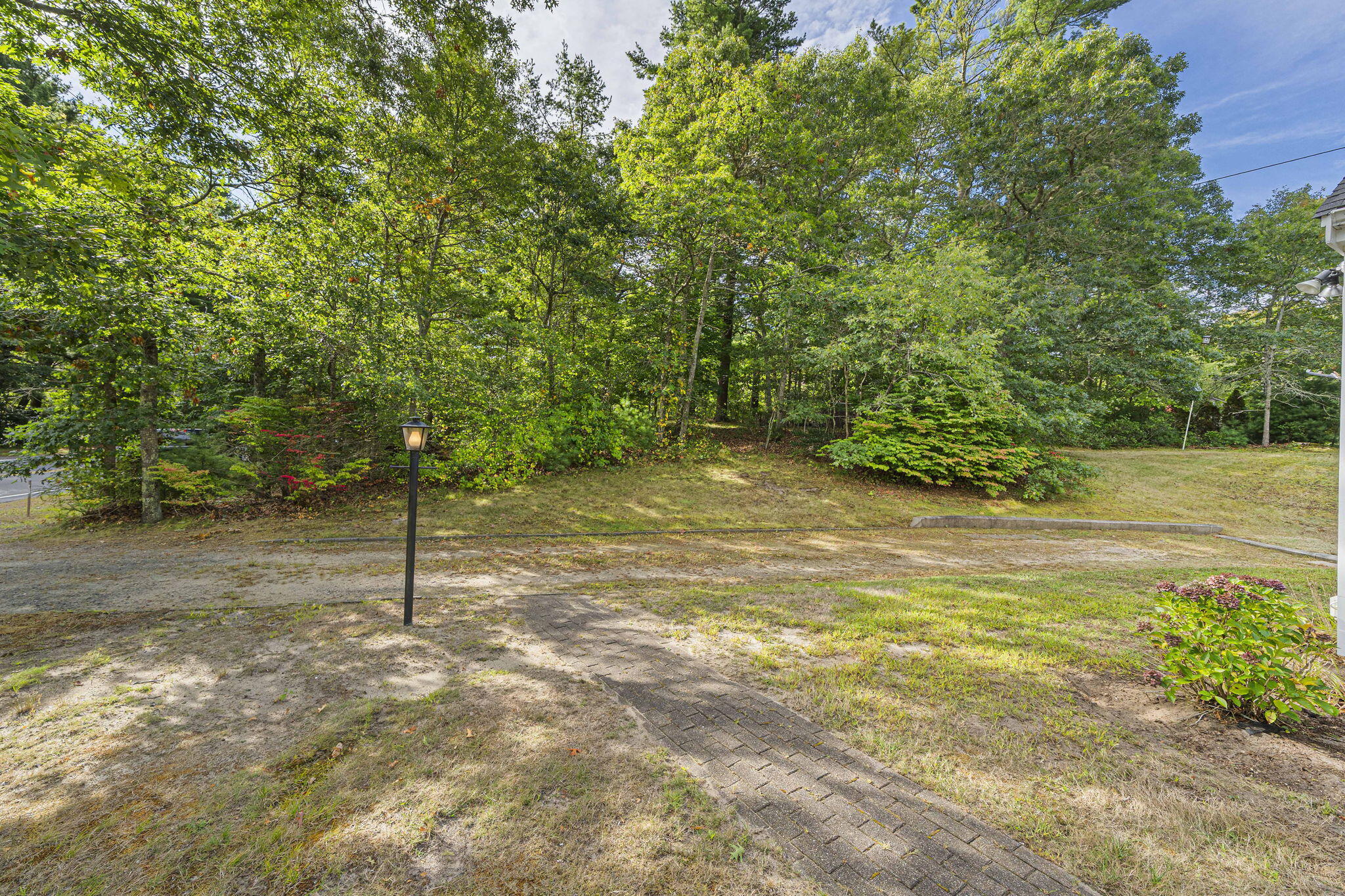 606 County Road Pocasset, MA 02559 - Photo 30 of 36 a view of a yard with a tree