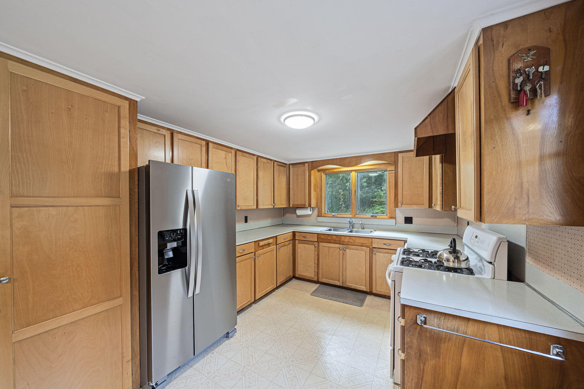 606 County Road Pocasset, MA 02559 - Photo 3 of 36 a kitchen with a refrigerator and a sink