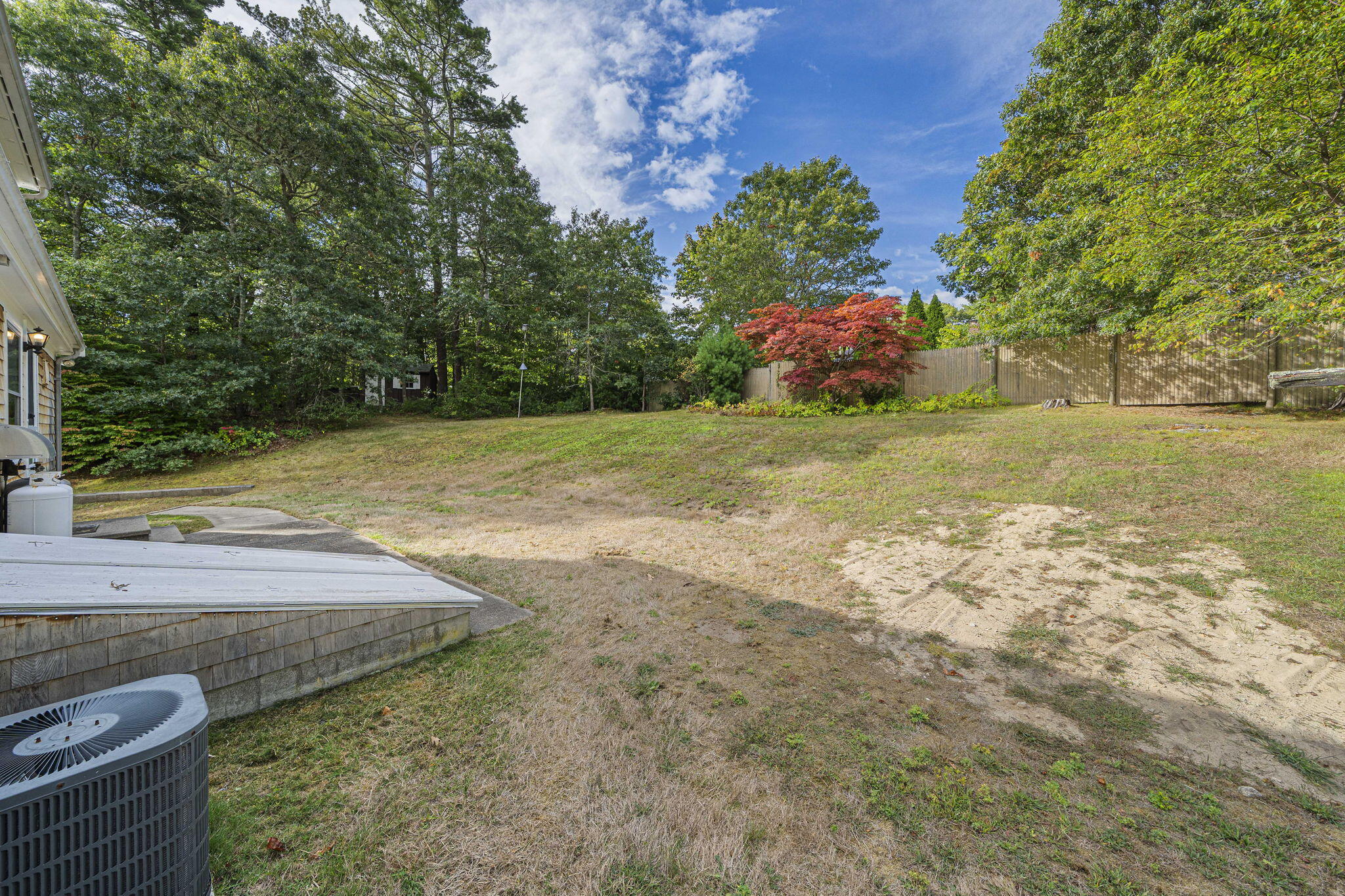 606 County Road Pocasset, MA 02559 - Photo 32 of 36 a view of a yard with an outdoor space
