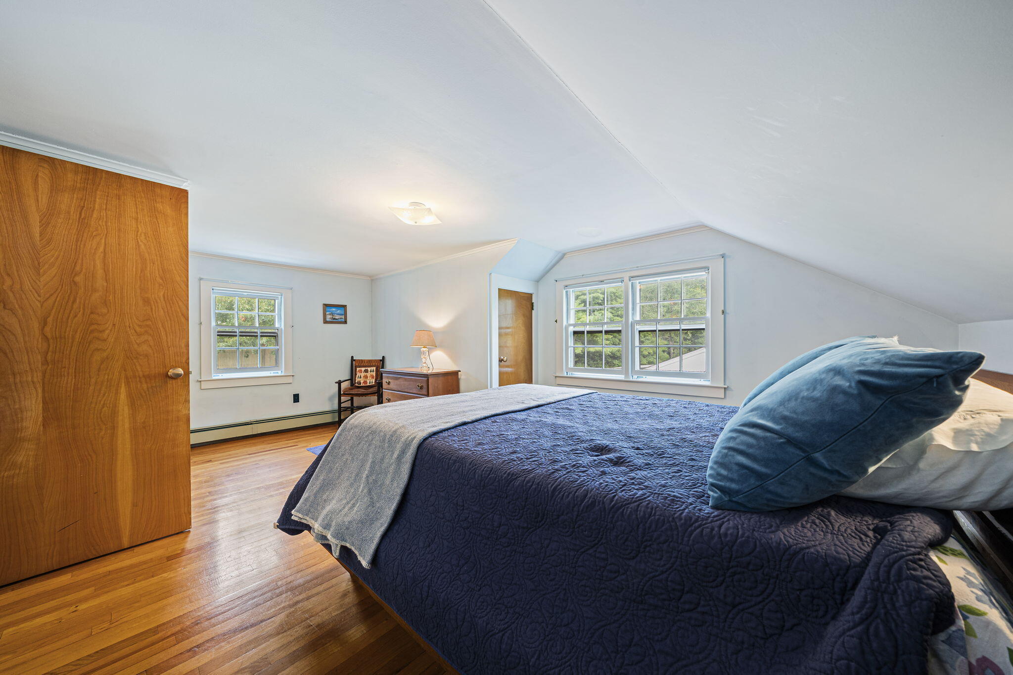 606 County Road Pocasset, MA 02559 - Photo 9 of 36 a bed sitting in a bedroom next to a window