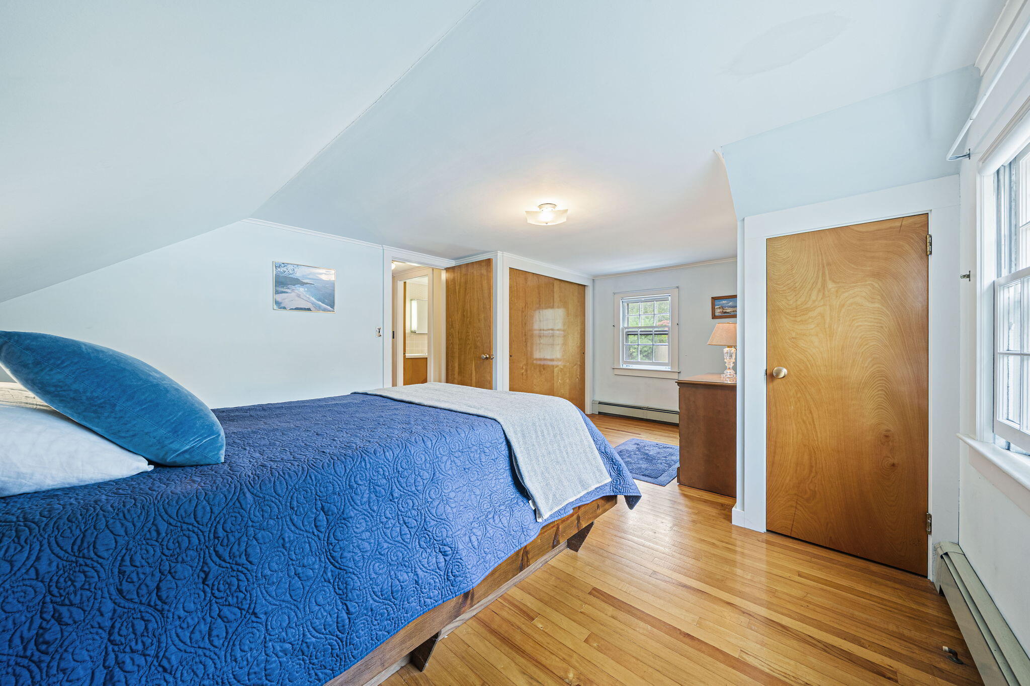 606 County Road Pocasset, MA 02559 - Photo 10 of 36 a bedroom with a bed and wooden floor