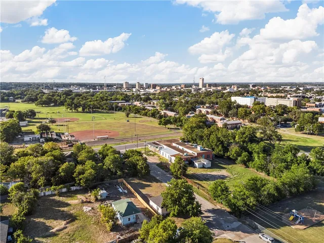 an aerial view of residential houses with outdoor space