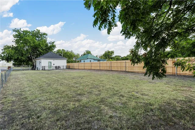 a house view with a garden space