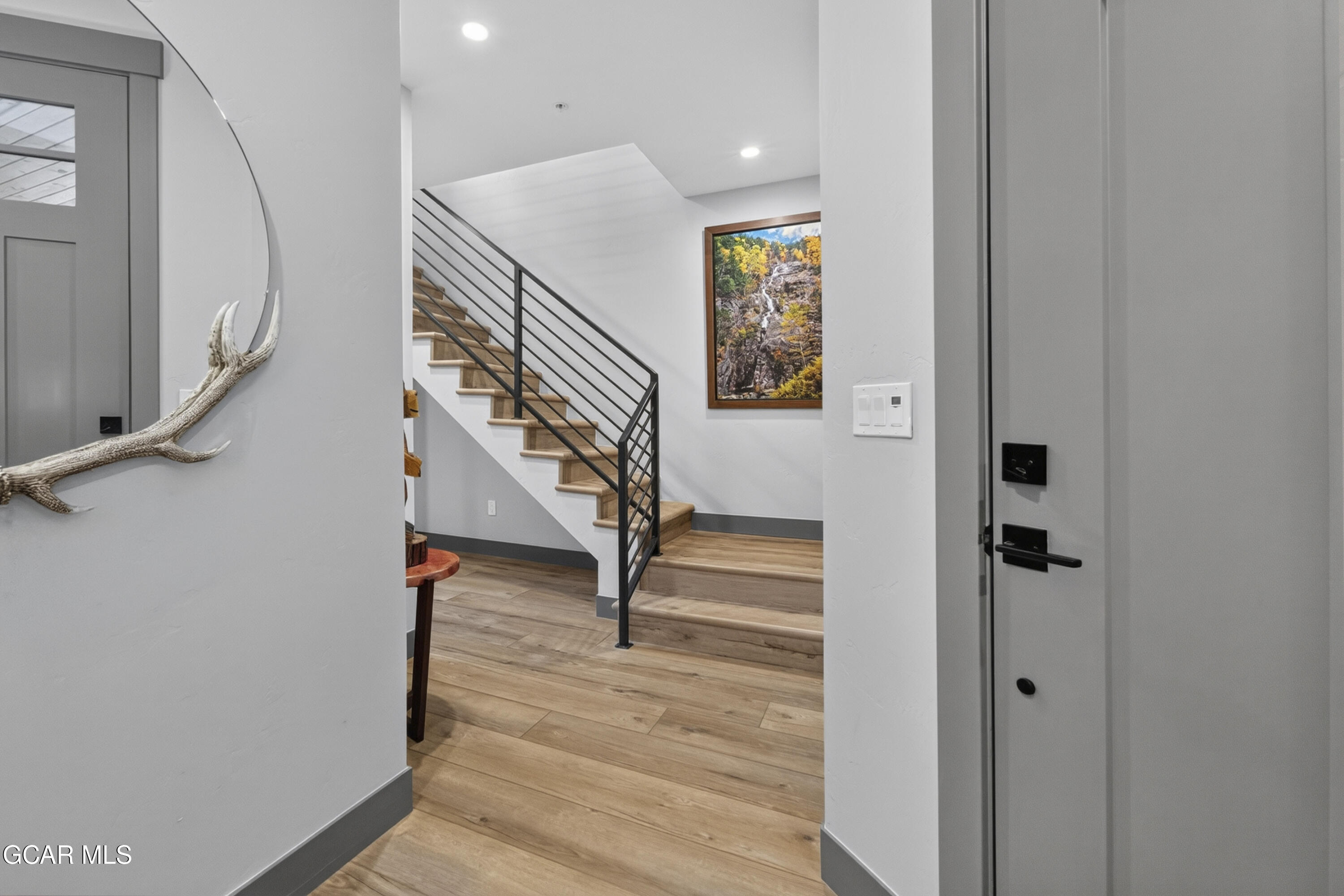 154 Eagle Ridge Drive Granby, CO 80446 - Photo 14 of 59 a view of entryway and hall with wooden floor