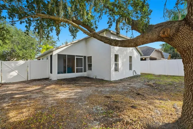 a view of a house with a yard and garage