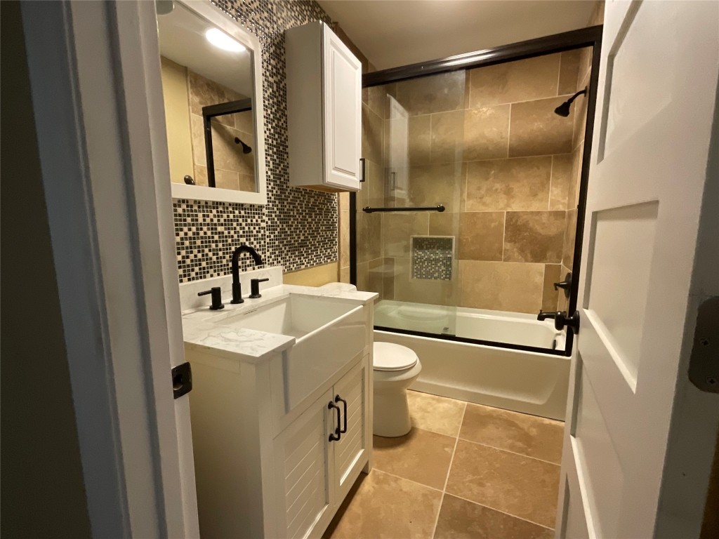 207 South George Street Victoria, TX 77901 - Photo 11 of 27 a bathroom with a sink toilet and shower