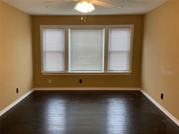 a view of room with window and hardwood floor