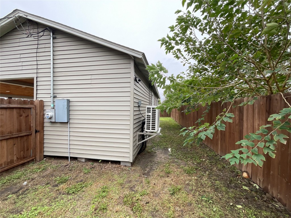 207 South George Street Victoria, TX 77901 - Photo 22 of 27 a view of a house with a yard and wooden fence