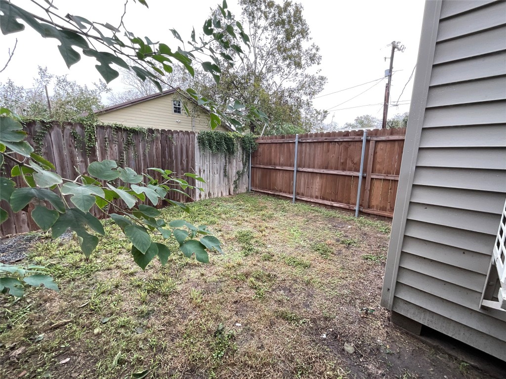 207 South George Street Victoria, TX 77901 - Photo 23 of 27 a backyard of a house with lots of green space