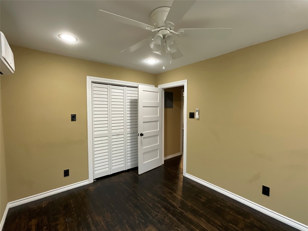 207 South George Street Victoria, TX 77901 - Photo 9 of 27 an empty room with wooden floor and closet