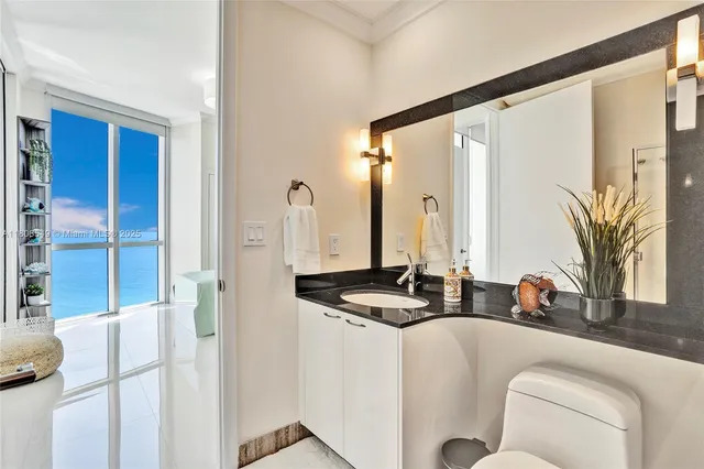 a view of a room with table and chairs