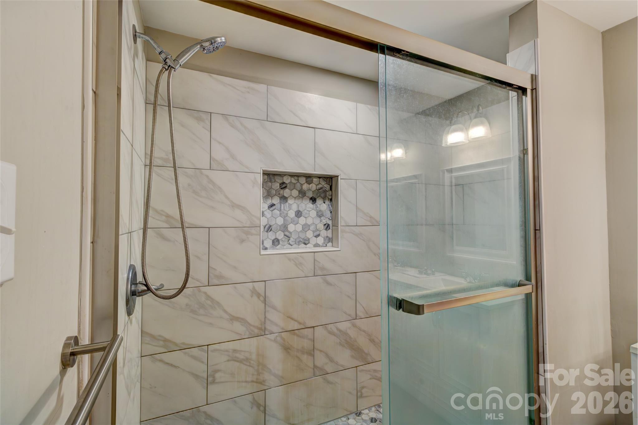 202 Ramsey Street Cherryville, NC 28021 - Photo 12 of 17 a bathroom with a glass shower door