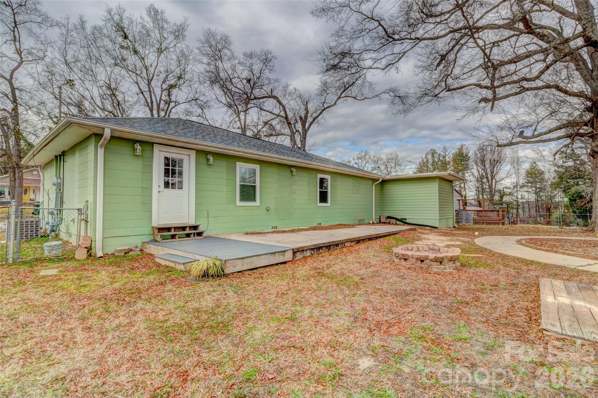 202 Ramsey Street Cherryville, NC 28021 - Photo 15 of 17 a view of a house with a yard and garage