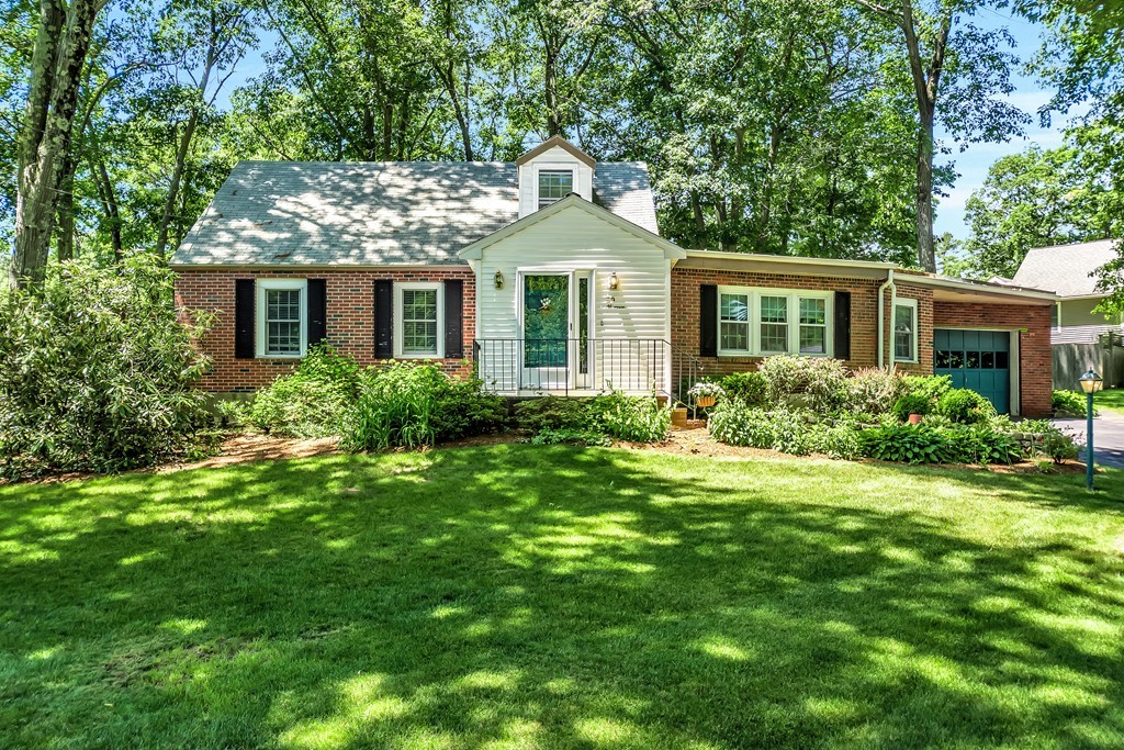 59 Munroe Road Lexington, MA 02421 - Photo 1 of 29 a front view of a house with garden