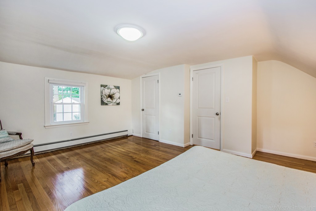 59 Munroe Road Lexington, MA 02421 - Photo 13 of 29 a view of a room with a window and a ceiling fan