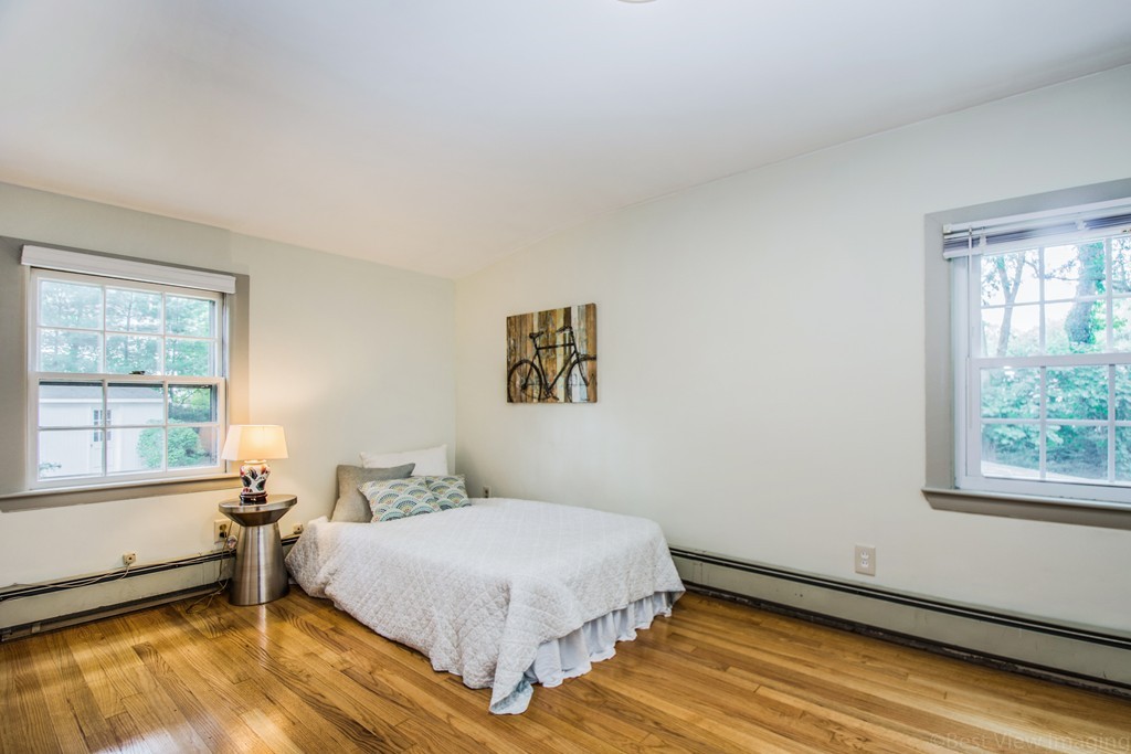 59 Munroe Road Lexington, MA 02421 - Photo 15 of 29 a bedroom with a bed and a window
