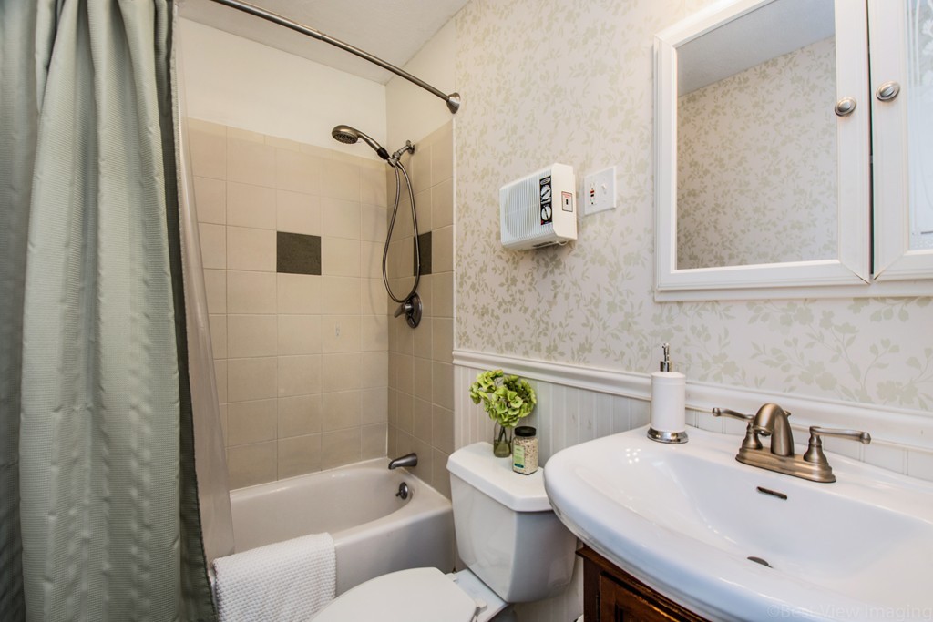 59 Munroe Road Lexington, MA 02421 - Photo 18 of 29 a bathroom with a sink toilet and shower