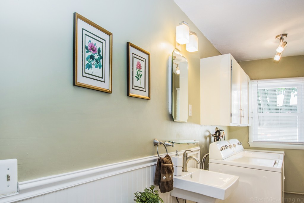 59 Munroe Road Lexington, MA 02421 - Photo 21 of 29 a bathroom with a sink a mirror and a bathtub