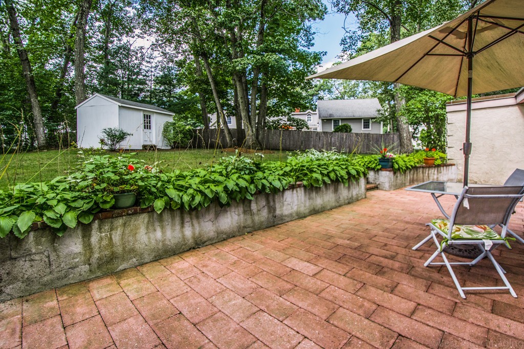 59 Munroe Road Lexington, MA 02421 - Photo 22 of 29 a view of a backyard with sitting area