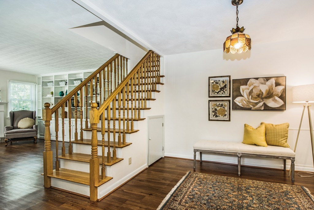 59 Munroe Road Lexington, MA 02421 - Photo 5 of 29 a bedroom with stairs and a wooden floor
