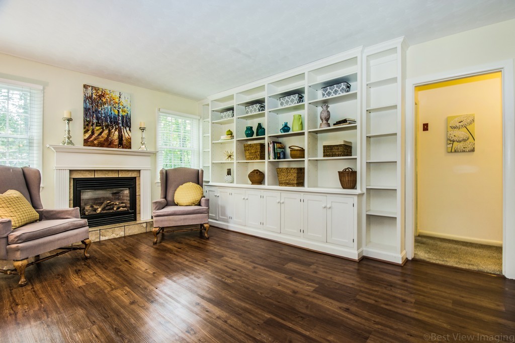 59 Munroe Road Lexington, MA 02421 - Photo 6 of 29 a living room with furniture and a fireplace
