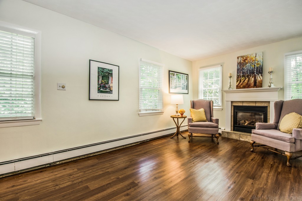 59 Munroe Road Lexington, MA 02421 - Photo 7 of 29 a living room with furniture and a fireplace