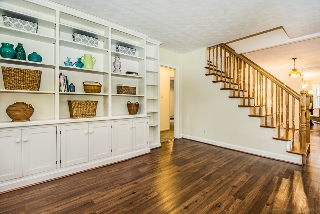 59 Munroe Road Lexington, MA 02421 - Photo 8 of 29 a view of an entryway with wooden floor and front door