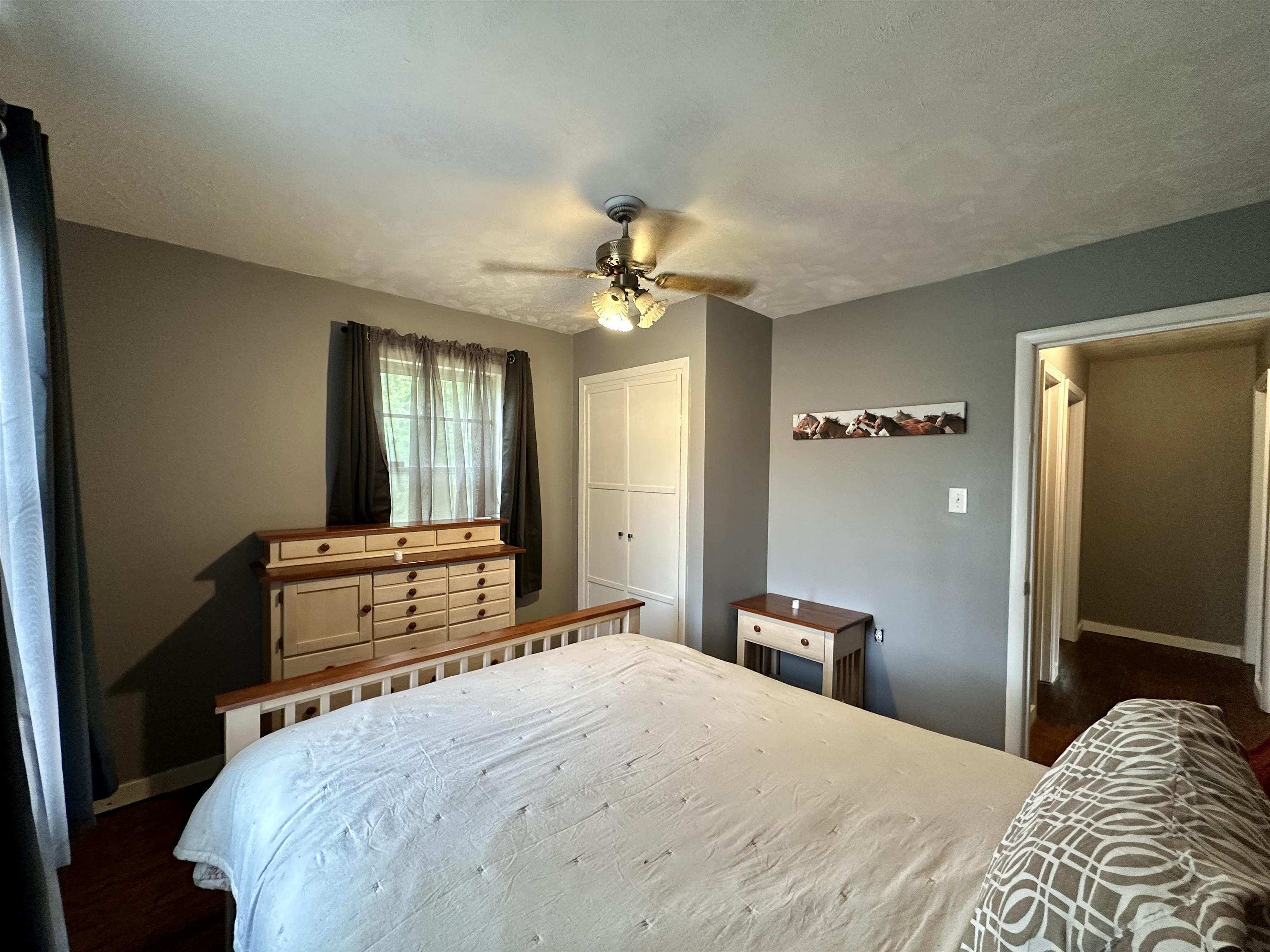 2505 Pittman Road Somerville, TN 38068 - Photo 15 of 23 Interior room featuring wood-finish flooring and neutral gray walls