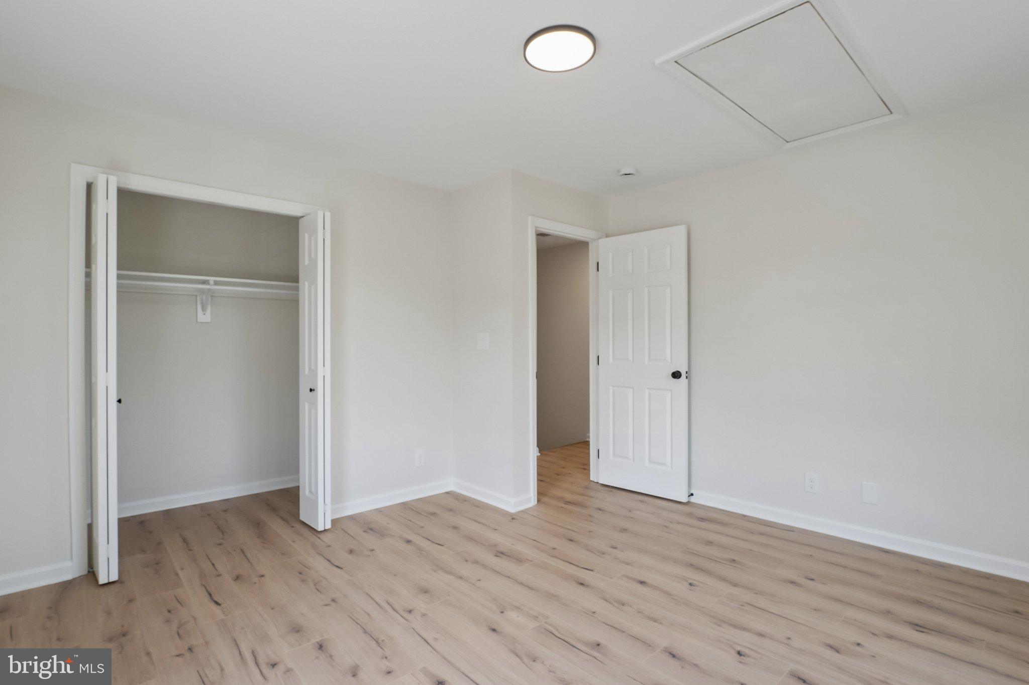 1992 Retta Gilliam Court Southeast Washington, DC 20020 - Photo 12 of 22 a view of an empty room with wooden floor