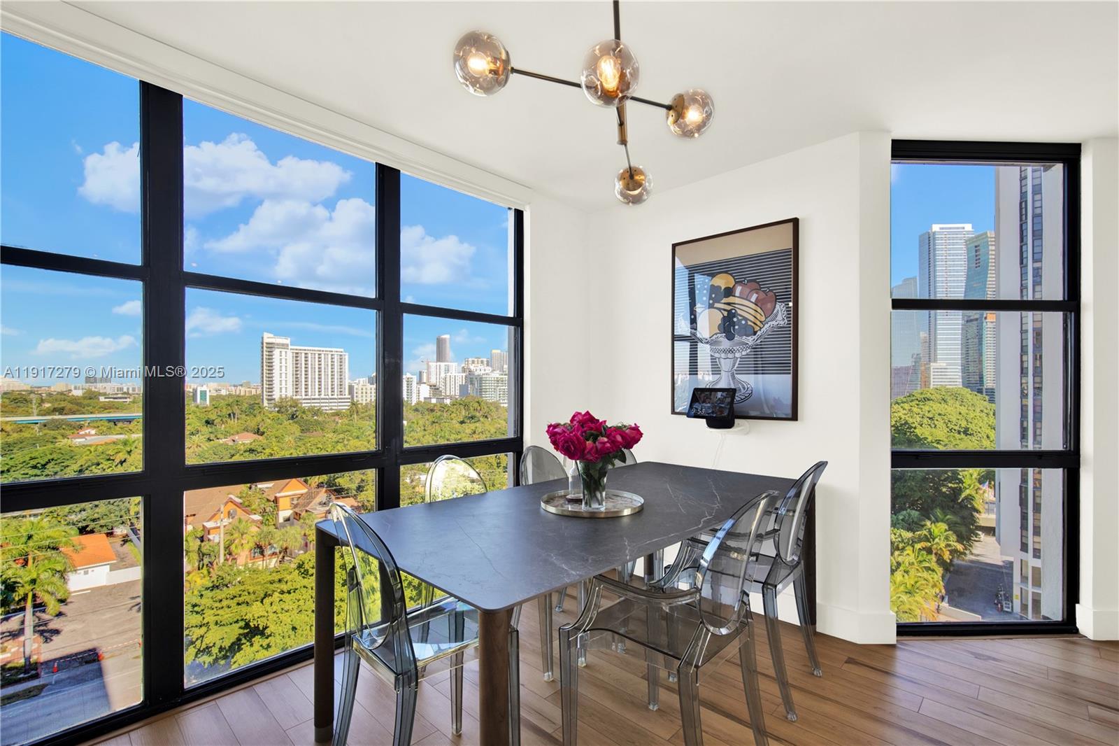 1915 Brickell Avenue, Unit C1101 Miami, FL 33129 - Photo 11 of 55 a view of a dining room with furniture window and wooden floor