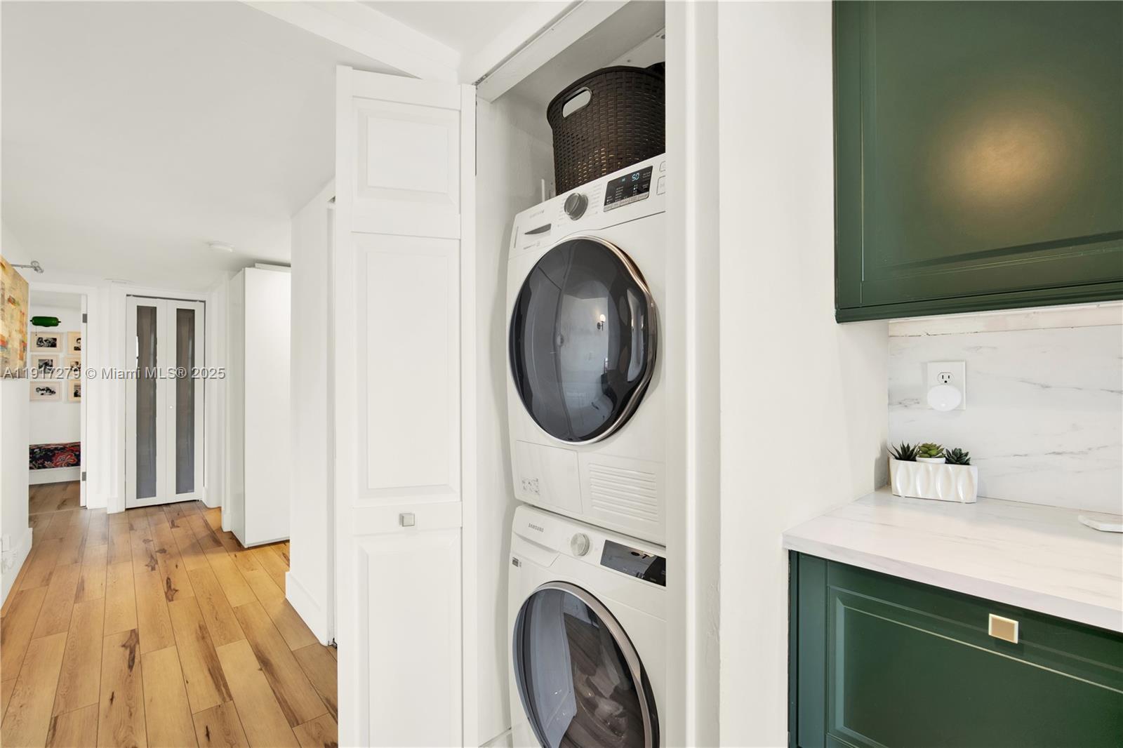 1915 Brickell Avenue, Unit C1101 Miami, FL 33129 - Photo 13 of 55 a view of a kitchen with washer and dryer