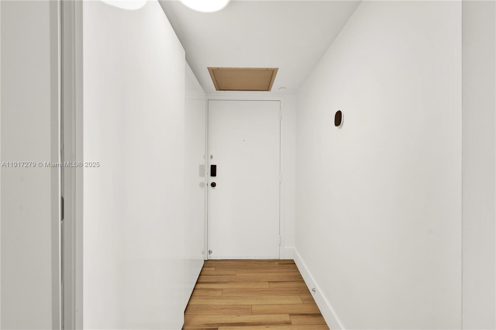 1915 Brickell Avenue, Unit C1101 Miami, FL 33129 - Photo 14 of 55 a view of a hallway with a white walls