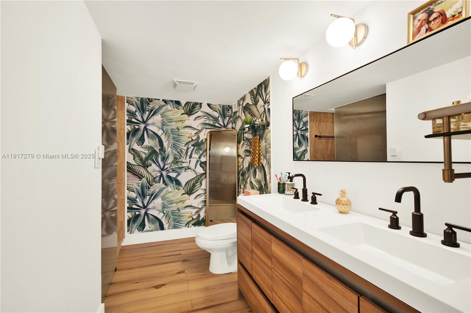 1915 Brickell Avenue, Unit C1101 Miami, FL 33129 - Photo 16 of 55 a bathroom with a sink and a mirror