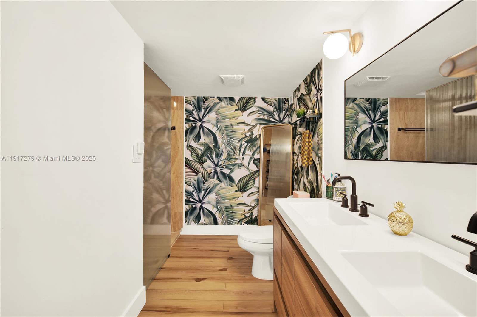 1915 Brickell Avenue, Unit C1101 Miami, FL 33129 - Photo 17 of 55 a bathroom with a sink and a mirror