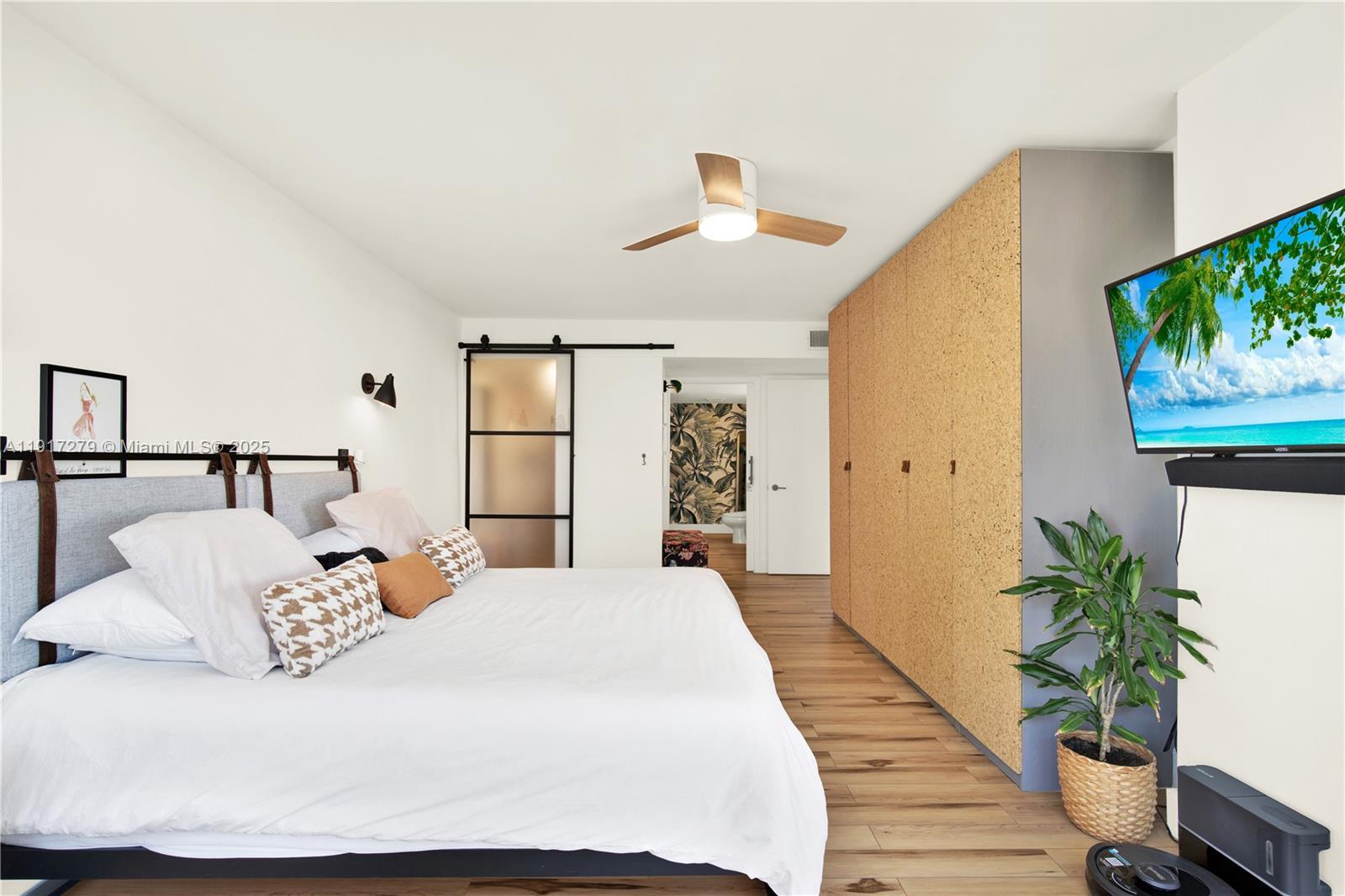 1915 Brickell Avenue, Unit C1101 Miami, FL 33129 - Photo 22 of 55 a bedroom with a large bed and a potted plant