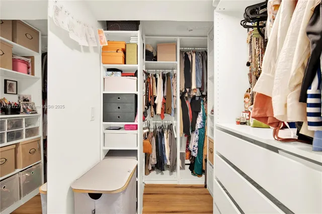 a bathroom with a sink mirror toilet and bathtub