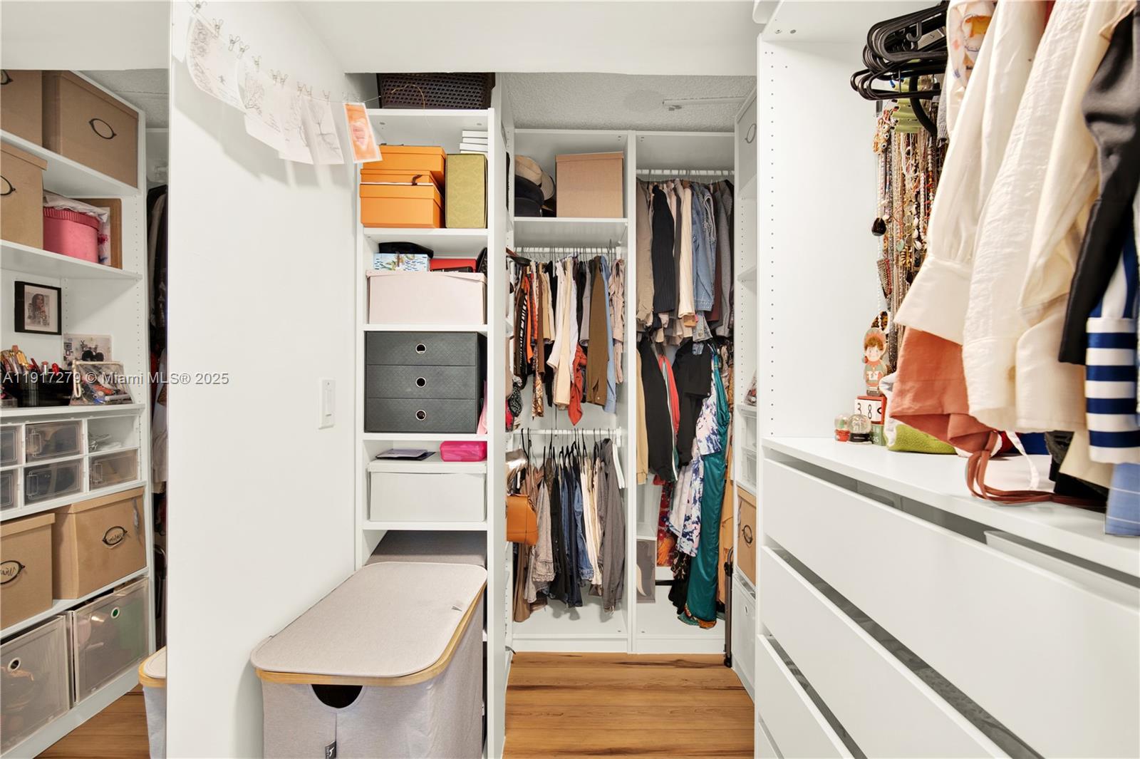 1915 Brickell Avenue, Unit C1101 Miami, FL 33129 - Photo 23 of 55 a view of walk in closet with clothes and shoes