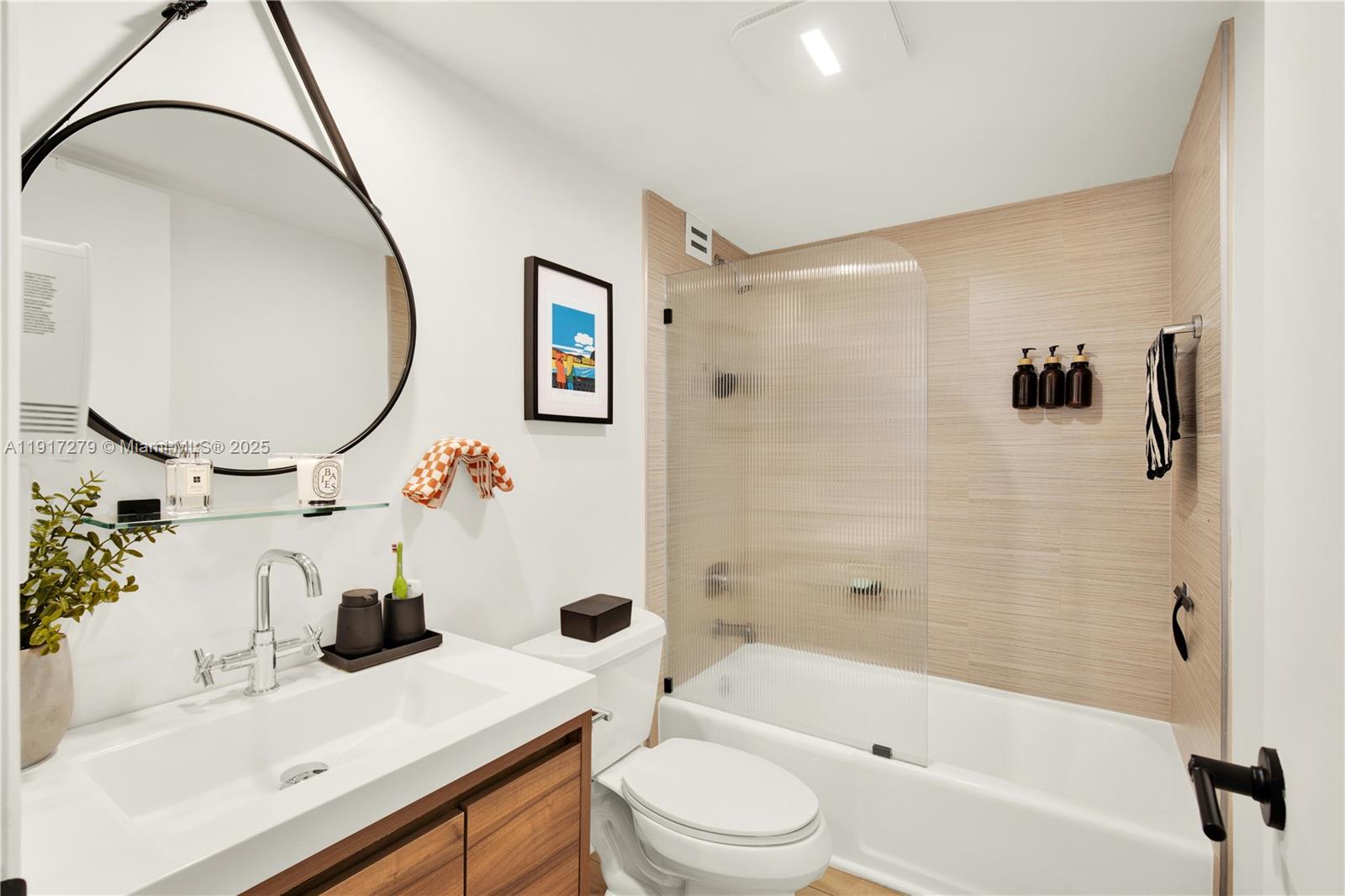 1915 Brickell Avenue, Unit C1101 Miami, FL 33129 - Photo 24 of 55 a bathroom with a sink mirror toilet and bathtub