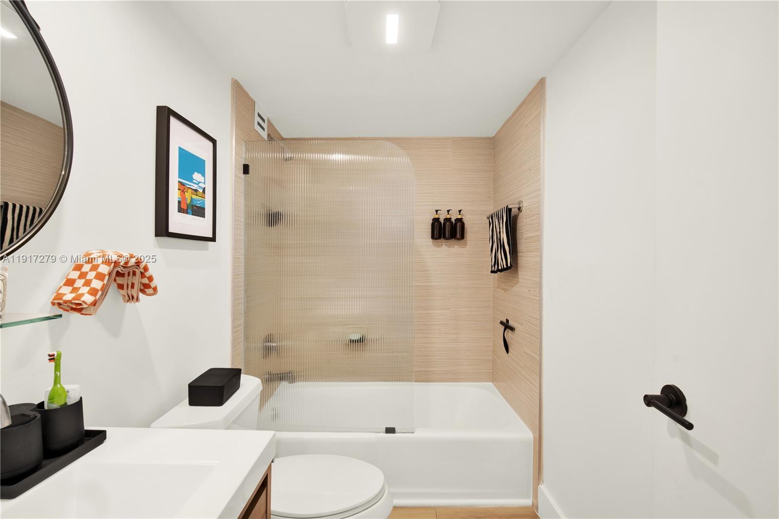 1915 Brickell Avenue, Unit C1101 Miami, FL 33129 - Photo 25 of 55 a bathroom with a toilet sink and a bathtub