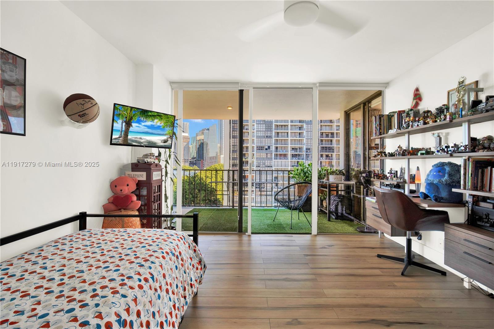 1915 Brickell Avenue, Unit C1101 Miami, FL 33129 - Photo 27 of 55 a bedroom with a bed and wooden floor