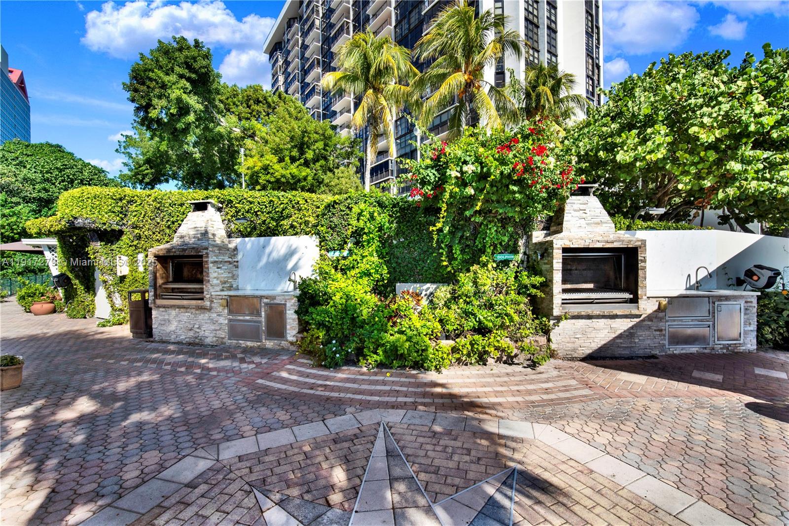1915 Brickell Avenue, Unit C1101 Miami, FL 33129 - Photo 43 of 55 a front view of a house with a yard and garage