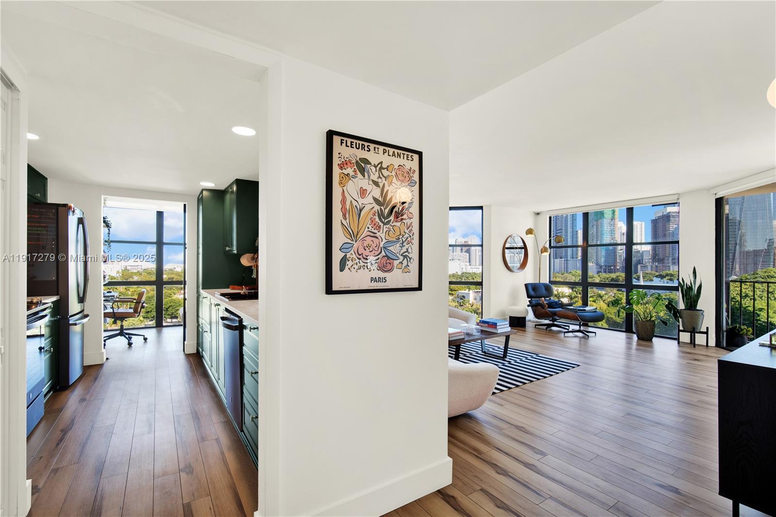 1915 Brickell Avenue, Unit C1101 Miami, FL 33129 - Photo 5 of 55 a living room with furniture and a wooden floor