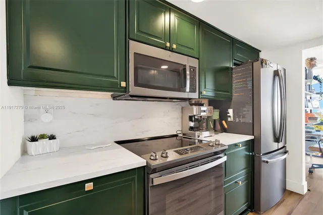 a kitchen with a stove and a microwave