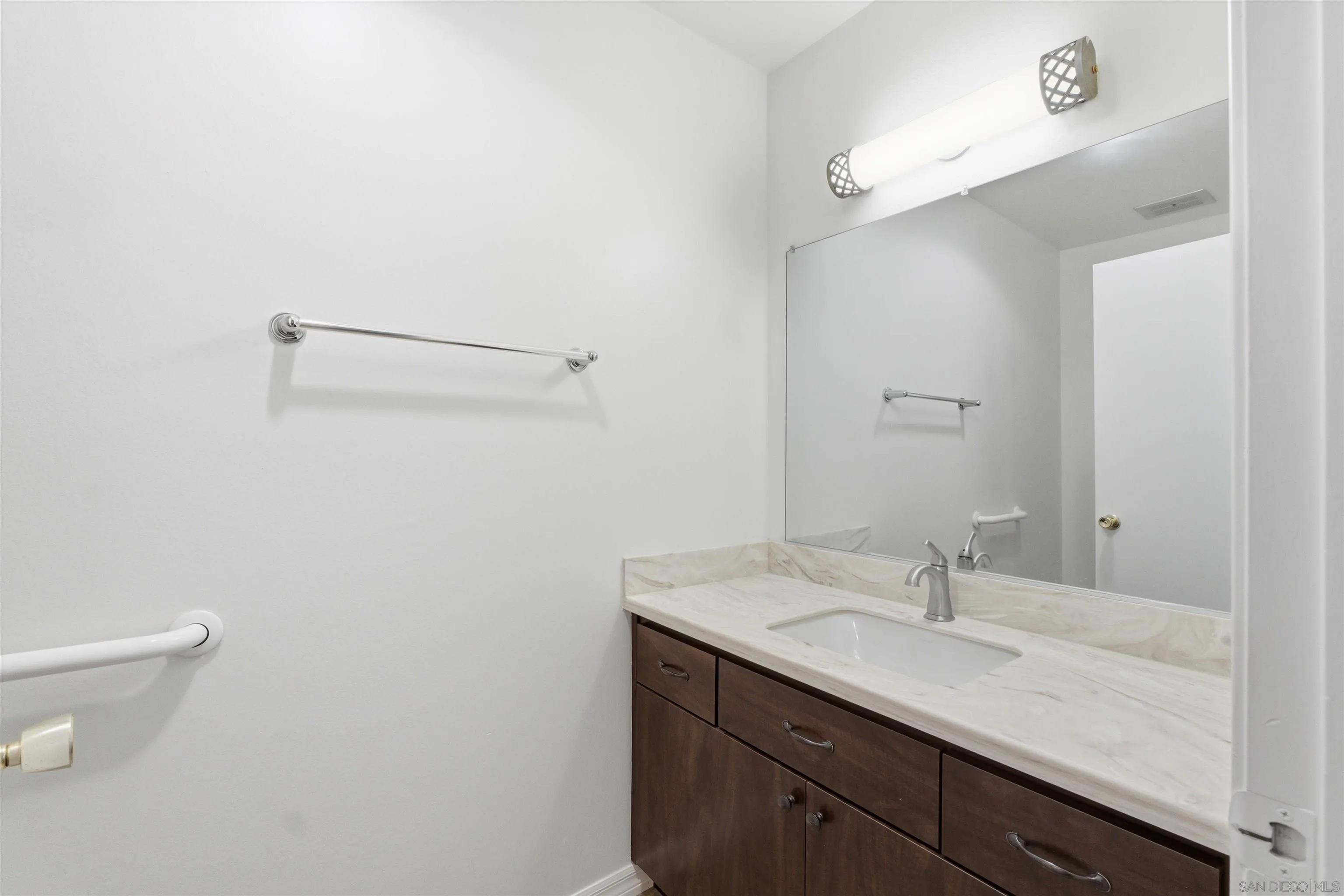 3625 Dearborn Street Oceanside, CA 92057 - Photo 14 of 30 a bathroom with a sink and a toilet