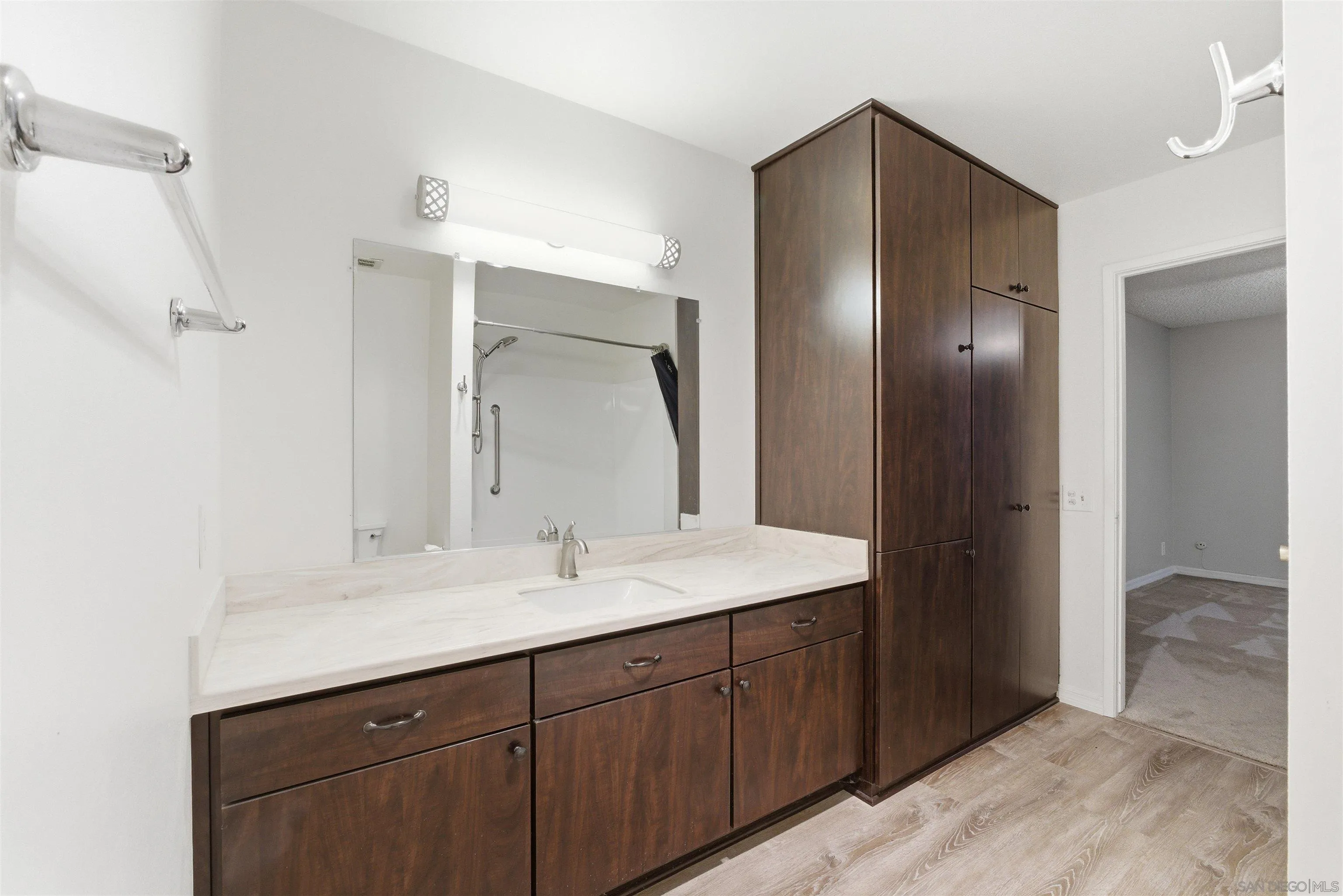 3625 Dearborn Street Oceanside, CA 92057 - Photo 22 of 30 a bathroom with a double vanity sink and mirror