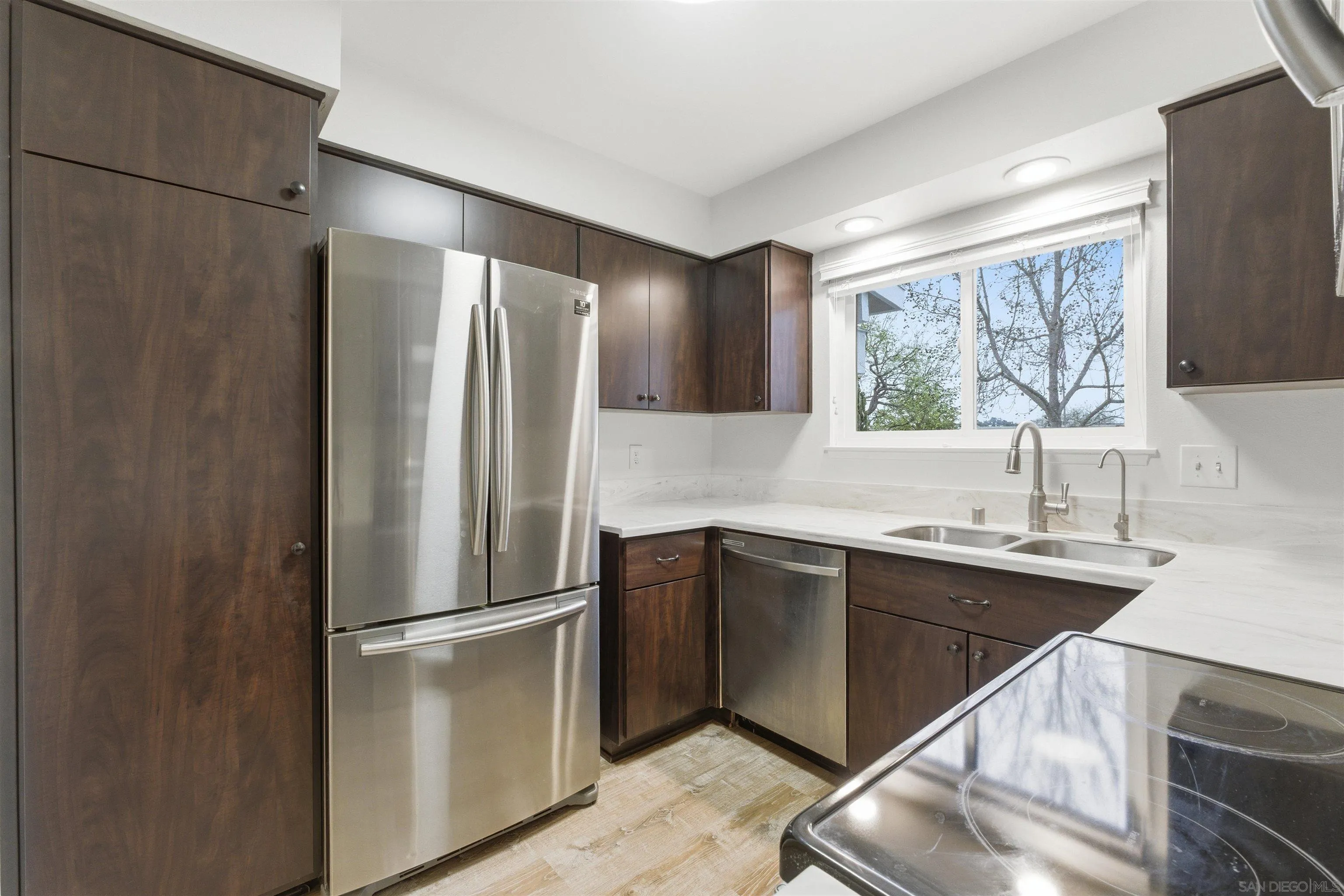 3625 Dearborn Street Oceanside, CA 92057 - Photo 4 of 30 a kitchen with stainless steel appliances a sink stove and refrigerator