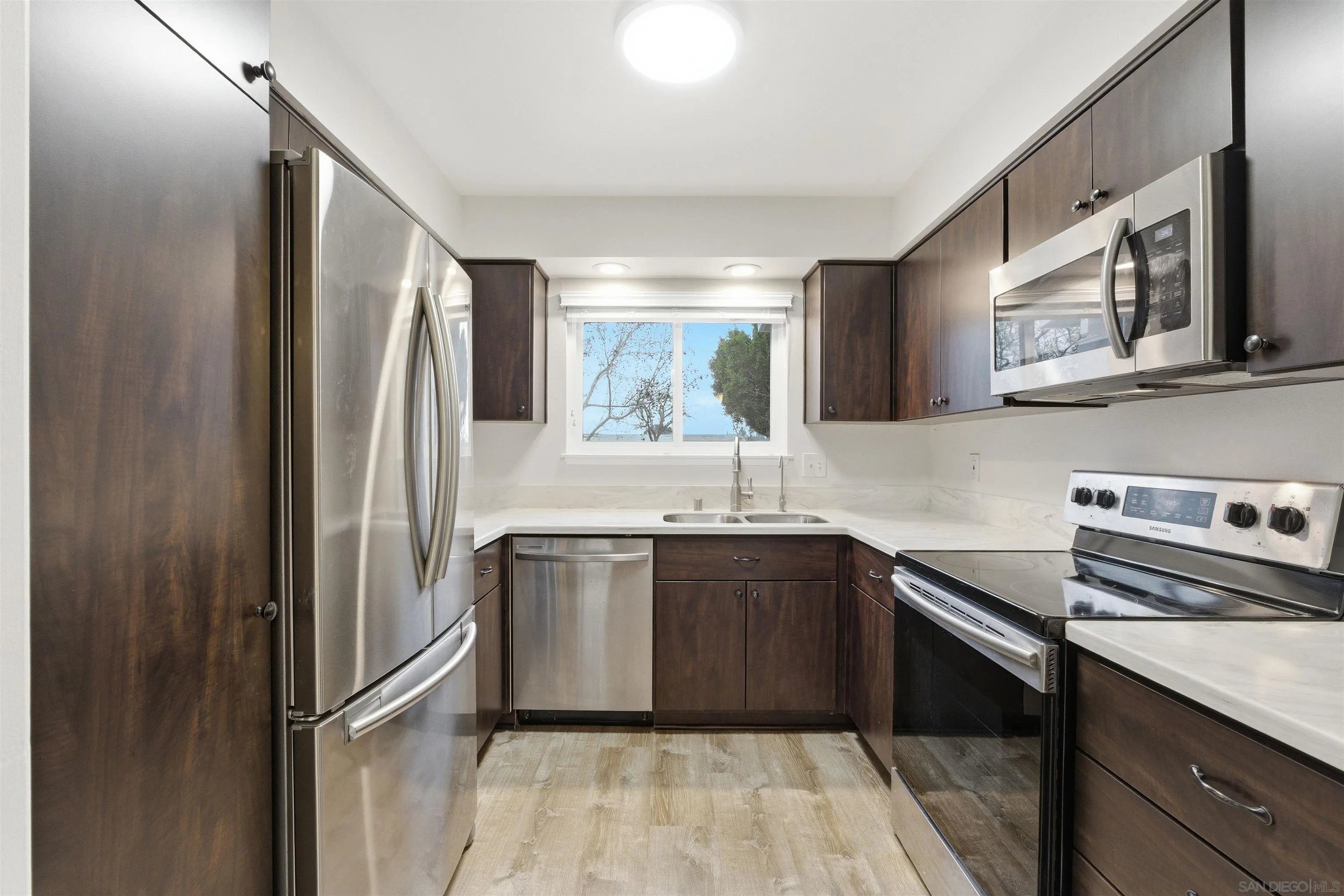 3625 Dearborn Street Oceanside, CA 92057 - Photo 10 of 30 a kitchen with stainless steel appliances granite countertop a refrigerator sink and stove